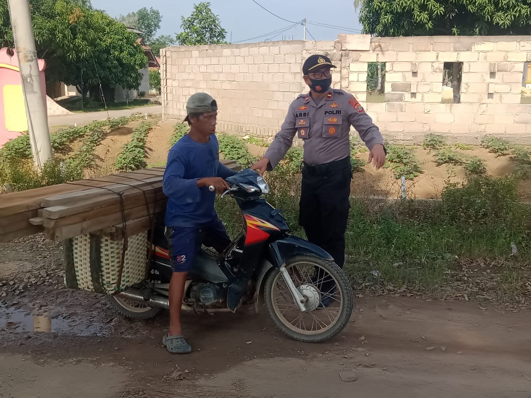 Kapolsek Gedung Aji Ajak Warga Untuk Disiplin Terapkan 3 M dan 1 T
